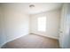 Neutral bedroom with natural light and carpet at 15 Golden Poppy Ln, Youngsville, NC 27596