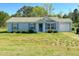 Charming single-story home with blue shutters, a front yard, and an attached garage at 15 Golden Poppy Ln, Youngsville, NC 27596