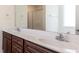 Bathroom featuring a double vanity and a glass shower door at 151 Goose Creek Cir, Dunn, NC 28334