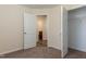 Bright bedroom shows open closet space with access to the adjacent room at 151 Goose Creek Cir, Dunn, NC 28334
