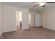 Bedroom featuring carpet, ceiling fan, and doorway access to the bathroom and walk-in closet at 151 Goose Creek Cir, Dunn, NC 28334