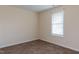 Cozy bedroom featuring neutral paint, plush carpet, and a window with modern blinds at 151 Goose Creek Cir, Dunn, NC 28334