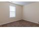 Bright bedroom features neutral walls, plush carpet, and a window with modern blinds at 151 Goose Creek Cir, Dunn, NC 28334