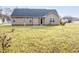 Charming single-story home with beige siding and a dark shingle roof at 151 Goose Creek Cir, Dunn, NC 28334