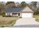 Charming single-story home featuring a well-maintained lawn and a two-car garage at 151 Goose Creek Cir, Dunn, NC 28334