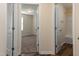 Hallway featuring three doorways at 151 Goose Creek Cir, Dunn, NC 28334