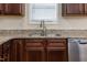 This is a kitchen featuring granite countertops, sink, and stainless steel dishwasher at 151 Goose Creek Cir, Dunn, NC 28334
