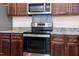 Gourmet kitchen featuring stainless steel appliances and granite countertops at 151 Goose Creek Cir, Dunn, NC 28334