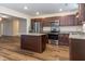 Spacious kitchen features granite countertops, a kitchen island, and stainless steel appliances at 151 Goose Creek Cir, Dunn, NC 28334