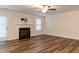 Bright and airy living room featuring a fireplace and new hardwood floors at 151 Goose Creek Cir, Dunn, NC 28334