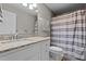 Functional bathroom featuring a vanity with granite countertop, mirror, and a shower-tub combo at 1965 Wedgewood Dr, Sanford, NC 27332