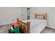 Charming bedroom with wooden bed frame and colorful toy piano, creating a playful atmosphere at 1965 Wedgewood Dr, Sanford, NC 27332