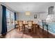Elegant dining room with hardwood floors, modern lighting, and seamless transition to the open kitchen at 1965 Wedgewood Dr, Sanford, NC 27332