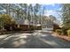 Charming brick home with an attached two-car garage surrounded by mature trees and professional landscaping at 1965 Wedgewood Dr, Sanford, NC 27332