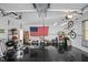 Organized garage with epoxy floor, American flag, and various storage solutions, suitable for projects and parking at 1965 Wedgewood Dr, Sanford, NC 27332