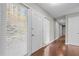 Inviting hallway with hardwood floors and natural light streaming through the front door and window at 1965 Wedgewood Dr, Sanford, NC 27332