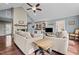 Spacious living room with fireplace, built-in shelving, hardwood floors and ample seating at 1965 Wedgewood Dr, Sanford, NC 27332
