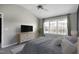 This bedroom features vaulted ceilings, many windows, and a TV at 200 Nottinghill Walk, Apex, NC 27502