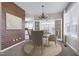 Formal dining room featuring a chandelier, wainscotting, and elegant decor at 200 Nottinghill Walk, Apex, NC 27502