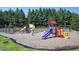 Community playground with colorful slides, swings, and play structures at 200 Nottinghill Walk, Apex, NC 27502