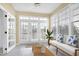 Cozy sunroom with lots of windows and doors and access to the outdoors at 200 Nottinghill Walk, Apex, NC 27502