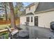 Backyard deck with outdoor seating and a grill, great for entertaining, with a view of the house at 204 Arnold Ln, Fuquay Varina, NC 27526