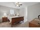 Neutral bedroom with classic wood bed frame, side tables, and lamps at 204 Arnold Ln, Fuquay Varina, NC 27526