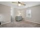 Bedroom featuring neutral walls and carpet, with large windows for lots of natural light at 204 Arnold Ln, Fuquay Varina, NC 27526