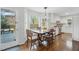 Sunlit dining area with a view of the backyard and adjacent deck access at 204 Arnold Ln, Fuquay Varina, NC 27526