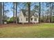 Beautiful two-story home with dormer windows and lush green lawn at 204 Arnold Ln, Fuquay Varina, NC 27526