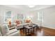 Inviting living room with natural light, hardwood floors, and comfortable seating at 204 Arnold Ln, Fuquay Varina, NC 27526