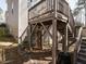 Wooden deck featuring stairs, surrounded by landscaping, offering great outdoor space at 2217 Magnolia Tree Ln, Durham, NC 27703