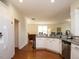 Open kitchen layout features stainless steel appliances, white cabinetry and granite countertops at 2217 Magnolia Tree Ln, Durham, NC 27703