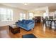 Bright open-concept living area with hardwood floors and an abundance of natural light at 2217 Magnolia Tree Ln, Durham, NC 27703