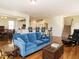 Open-concept living area with hardwood floors, and open access to the kitchen at 2217 Magnolia Tree Ln, Durham, NC 27703
