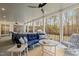 Inviting back porch with plush seating and a ceiling fan overlooking the backyard at 2223 Winston Cir, Apex, NC 27502