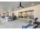 Spacious covered patio with outdoor bar seating, sliding glass doors, and a serene backyard view at 2223 Winston Cir, Apex, NC 27502