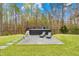 Backyard retreat featuring lounge seating and a small pool at 2223 Winston Cir, Apex, NC 27502