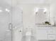 Modern bathroom with glass shower and stylish, white vanity and fixtures at 2223 Winston Cir, Apex, NC 27502