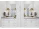 Elegant bathroom featuring a marble countertop, double sinks and brushed gold lighting at 2223 Winston Cir, Apex, NC 27502