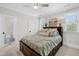 Comfortable bedroom featuring a ceiling fan, bedside table, and plenty of natural light at 2223 Winston Cir, Apex, NC 27502
