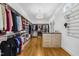 Large walk-in closet with plenty of shelving, drawers, and hanging storage space at 2223 Winston Cir, Apex, NC 27502