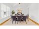 Elegant dining room featuring a vaulted ceiling, stylish lighting, and seating for eight at 2223 Winston Cir, Apex, NC 27502
