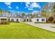 Charming home with lush front lawn, driveway, and a three-car garage at 2223 Winston Cir, Apex, NC 27502