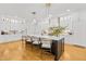 Spacious kitchen features a large island with seating and elegant pendant lighting at 2223 Winston Cir, Apex, NC 27502