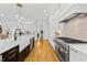 Well-appointed kitchen with stainless appliances, a center island and modern lighting at 2223 Winston Cir, Apex, NC 27502