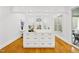 Spacious kitchen island with white cabinets, gold hardware, and hardwood floors at 2223 Winston Cir, Apex, NC 27502