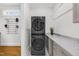 Convenient laundry room with stackable washer and dryer and quartz countertop at 2223 Winston Cir, Apex, NC 27502