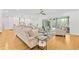 Bright living room with an open floor plan and sliding glass doors, perfect for indoor-outdoor living and entertaining at 2223 Winston Cir, Apex, NC 27502