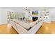 Cozy living room with a fireplace, built-in shelves, and lots of natural light, creating a warm and inviting atmosphere at 2223 Winston Cir, Apex, NC 27502